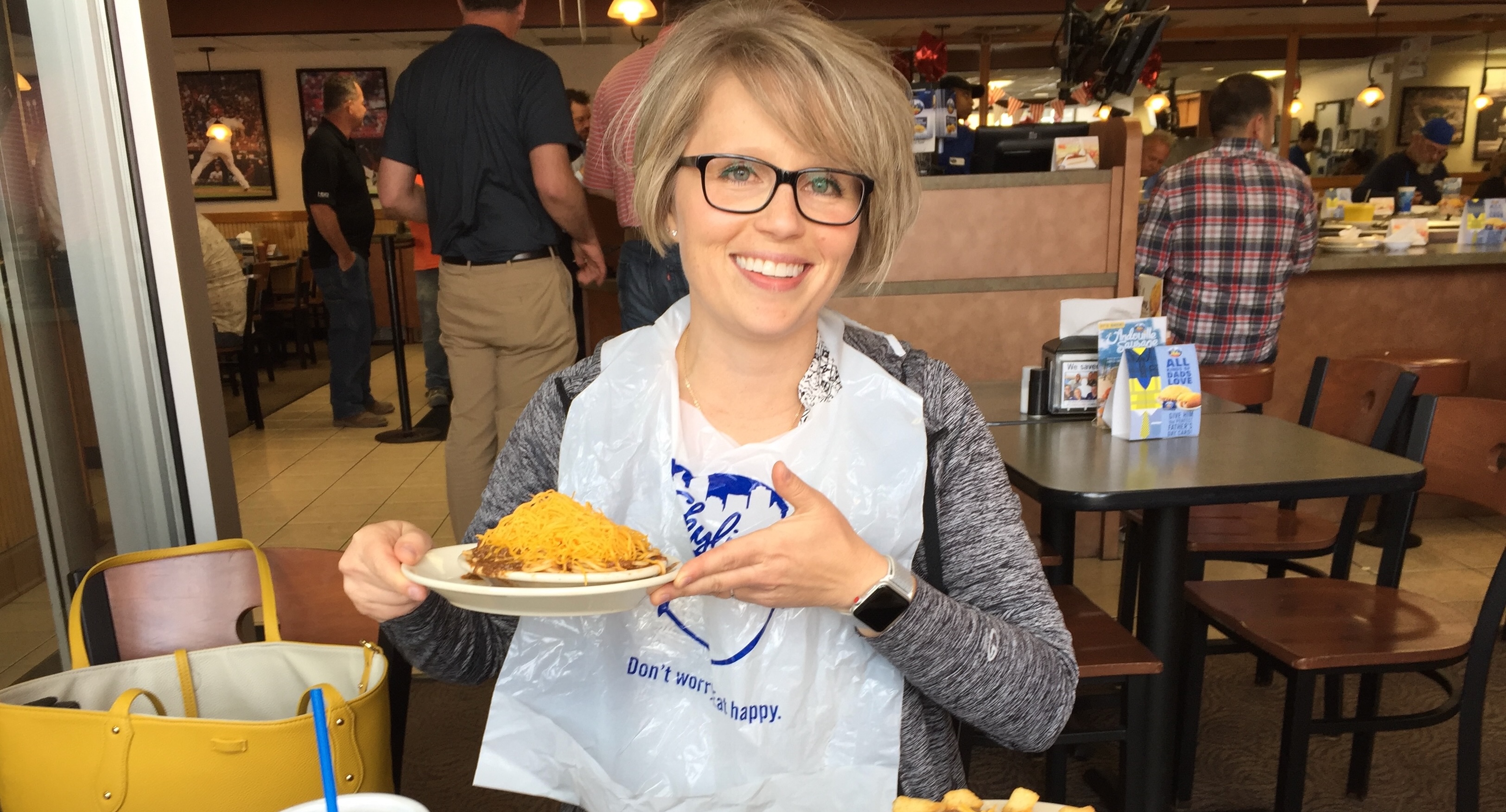 Megan Kirts in Cincinnati with a bowl of Cincinnati chili.