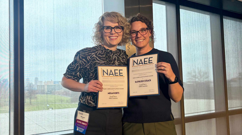 Econiful team members Megan Kirts and Kathleen Cusack accepting the NAEE Curriculum Platinum Award of Excellence for Unit 4: Global Connections, March 2026.
