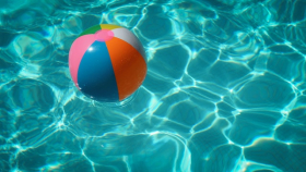 Beach ball floating in a pool