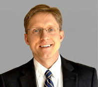 Photo of Benjamin Reed Shiller, author of AI Economics. 
