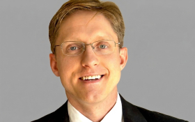 Photo of Benjamin Reed Shiller, author of AI Economics. 