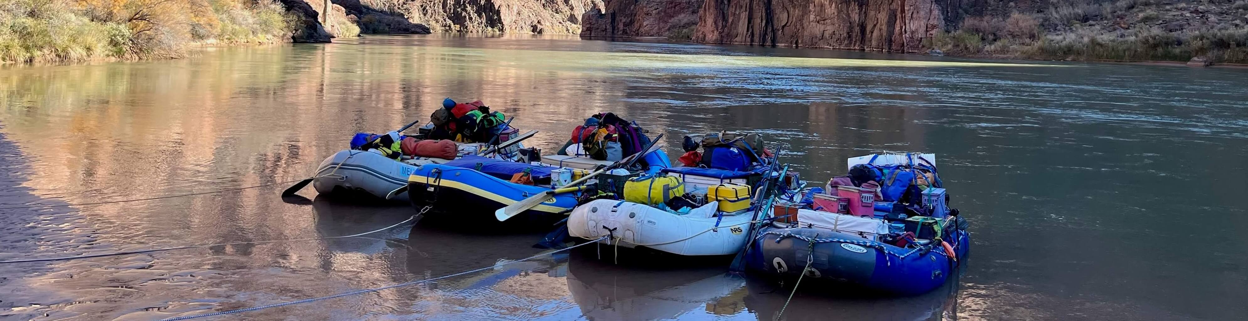 Boats filled with supplies line the shores of the Colorado River in Arizona.
