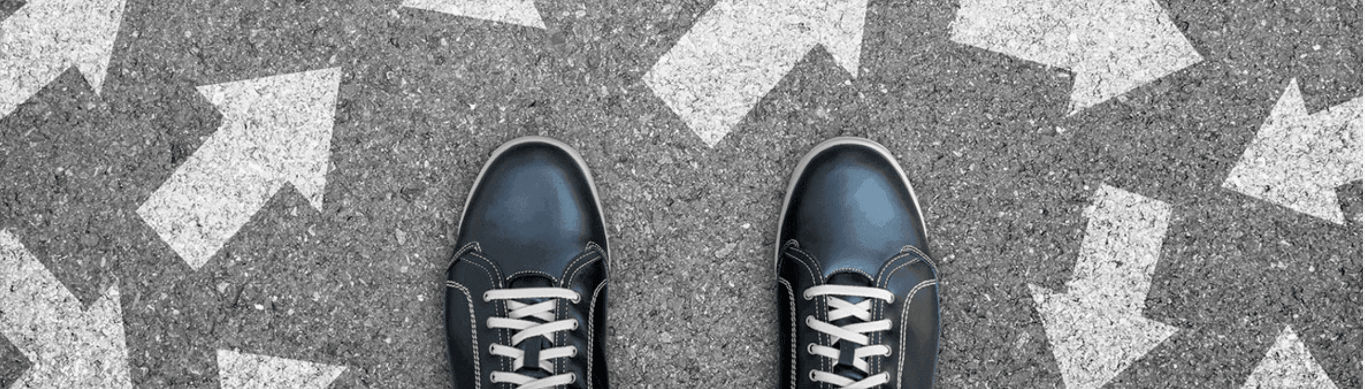 Two feet appear over graphic of arrows pointing in different directions to give a visualization of the principles of decision making.
