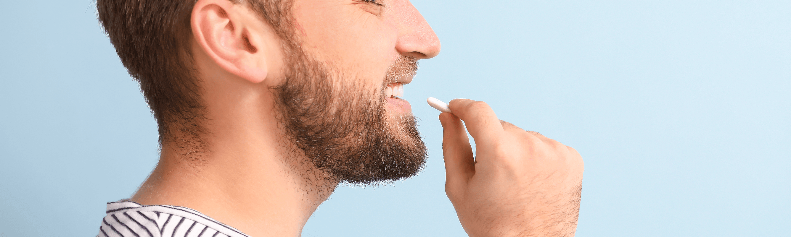 Man chewing a piece of gum as a visual representation of the law of diminishing marginal utility.