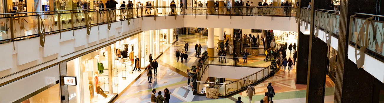 People move throughout levels of a busy mall to demonstrate shifts in demand.