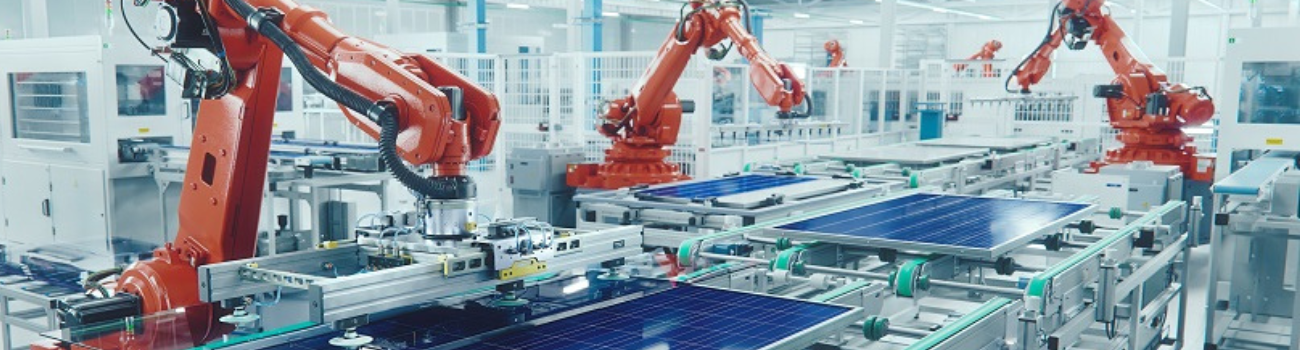 Robotic arms line a factory assembly line to demonstrate shifts in supply.