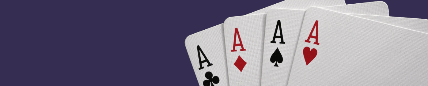Four aces from a playing card deck fanned out against a deep purple background, representing the card-based simulation where students experience how institutional rules shape economic outcomes.