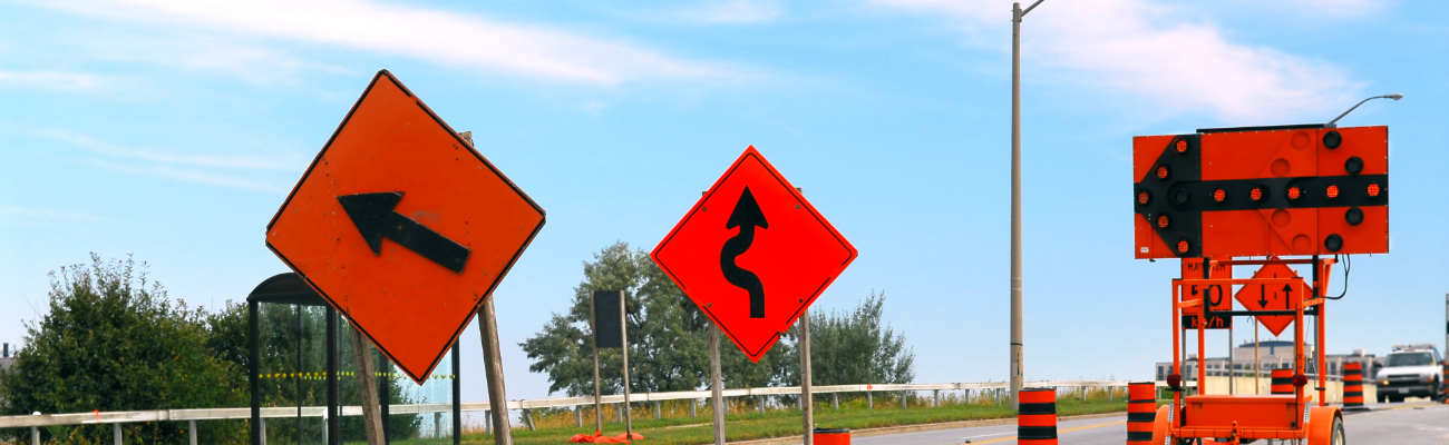Road signs depicting bumps and curves in the road to demonstrate common biases that emerge when thinking about insurance.