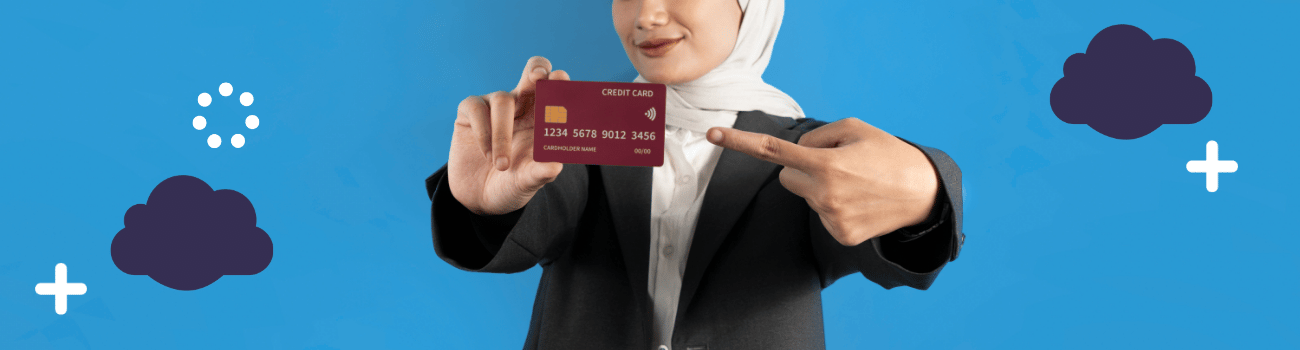 Woman points to a credit card she's holding to demonstrate the importance of credit scores.